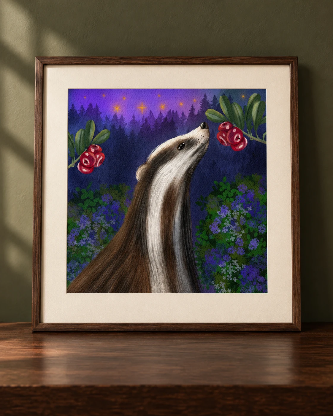 Badger art print concept in a dark oak frame on a desk